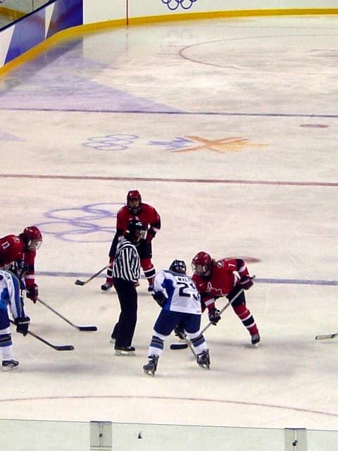 A women's ice hockey face-off